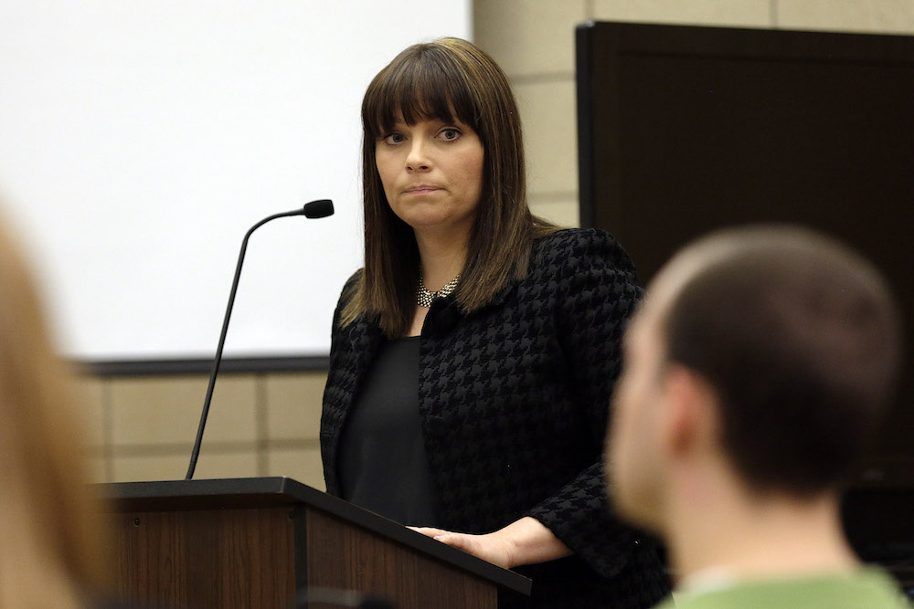 Assistant Johnson County Attorney Naeda Elliott looks at the defendant while giving the prosecution's opening statement in the trial of Alexander Kozak at the Story County Courthouse in Nevada on Thursday, April 14, 2016. Kozak is charged with first-degree murder in connection with the 2015 shooting death of Andrea Farrington at the Coral Ridge Mall. (Pool photo by Liz Martin/The Gazette)