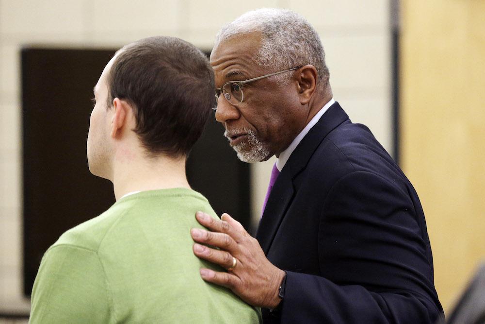 Alexander Kozak talks with defense attorney Alfredo Parrish after the prosecution's opening statement in in Kozak's trial at the Story County Courthouse in Nevada on Thursday, April 14, 2016. Alexander Kozak is charged with first-degree murder in connection with the 2015 shooting death of Andrea Farrington at the Coral Ridge Mall. (Pool photo by Liz Martin/The Gazette)