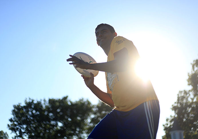 Harsh Patel plays frisbee with friends at Hubbard Park on Sunday. Patel is one of the new incoming freshmen at the University of Iowa. (The Daily Iowan/Rachael Westergard)