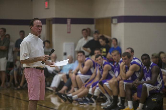 Coach and Prime Time League organizer Randy Larson addresses the crowd and the teams before the league championship game Thursday, July 31, in North Liberty. Randy Larsons team won 114-111. (The Daily Iowan/Sergio Flores)