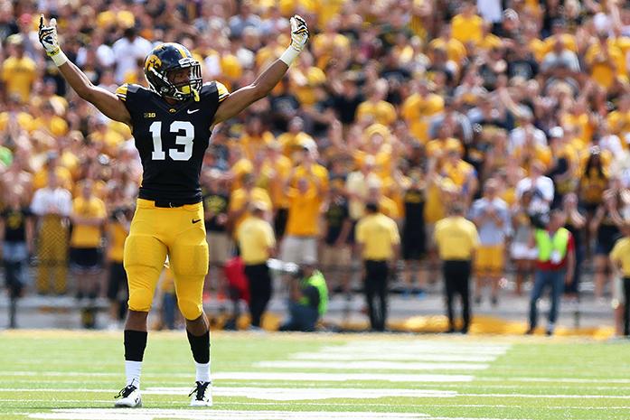 Iowa defensive back Greg Mabin pumps up the crowd to yell before the third down in Kinnick Stadium on Saturday, August 30, 2014 in Iowa City, IA. Mabin had four tackles on the game. The Hawkeyes beat the Panthers, 31-23. (The Daily Iowan/Alyssa Hitchcock)