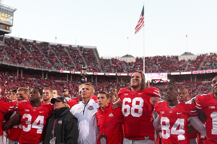 Ohio State players along with head coach Urban Meyer sing the school fight song at the end of the game at Ohio Stadium in Columbus, Ohio on Saturday, Oct. 19, 2013. Ohio State extended their winning streak to 19 games. Ohio State defeated Iowa, 34-24. (The Daily Iowan/file photo)