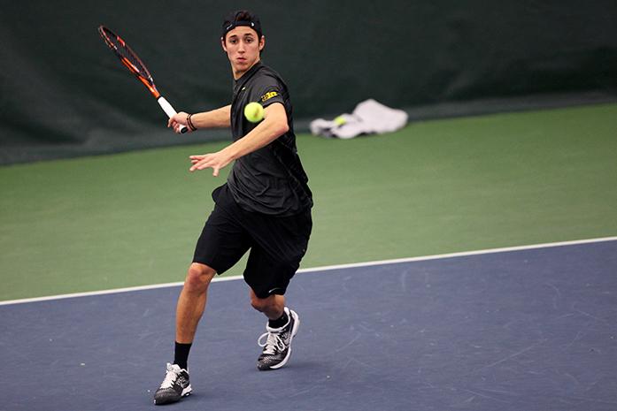 Iowa+tennis+player+Lefteris+Theodorou+volleys+the+ball+during+the+Iowa-Marquette+match+in+the+Hawkeye+Tennis+and+Recreation+Complex+on+Friday%2C+Feb.+6%2C+2015.+Theodorous+won+over+Marquettess+Nick+Dykema%2C+2-1+and+6-2.+The+Hawkeyes+defeated+the+Golden+Eagles%2C+7-0.+%28The+Daily+Iowan%2FMargaret+Kispert%29