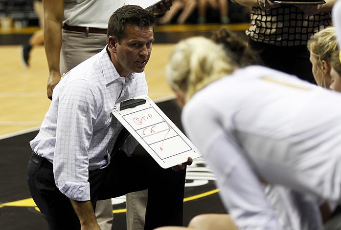 Iowa head coach Bond Shymansky gives his team a talk during a time out at Carver-Hawkeye Arena on Saturday, Sept. 27, 2014. Iowa was defeated by Nebraska 0-3.(The Daily Iowan/John Theulen)
