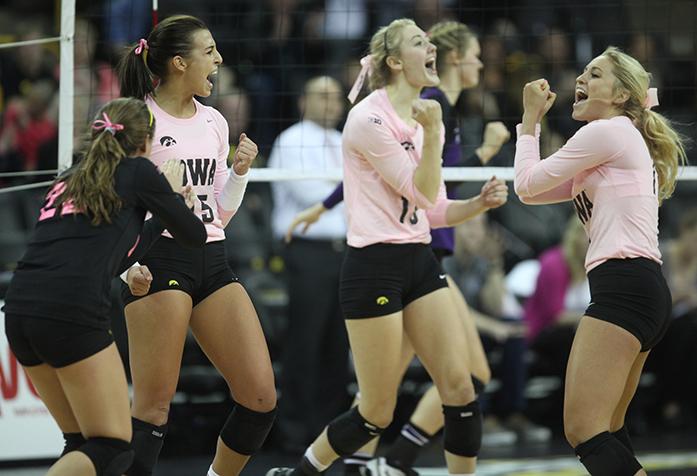 Iowa players celebrate a point at Carver-Hawkeye Arena on Saturday, Oct. 18, 2014. The Hawkeyes beat the Northwestern Wildcats 3-2. (The Daily Iowan/ Rachael Westergard)