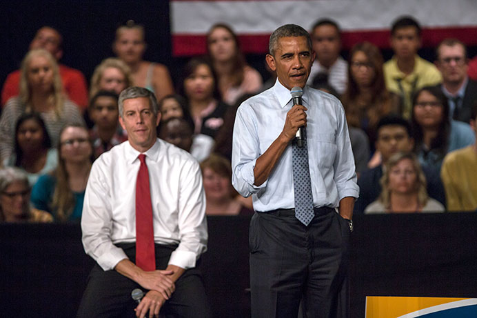 President Obama and Secretary of Education Arne Duncan speak to a crowd in the North High (Des Moines) auditorium on Monday. Obama and Duncan came to speak about changing the FAFSA and higher education in general. (The Daily Iowan/Sergio Flores) 