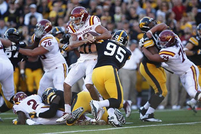 Iowa defensive lineman Drew Ott tackles Iowa State quarterback Sam Richardson in Kinnick Stadium on Saturday, Sept. 13, 2014. Iowa State defeated Iowa, 20-17. (The Daily Iowan/Valerie Burke)