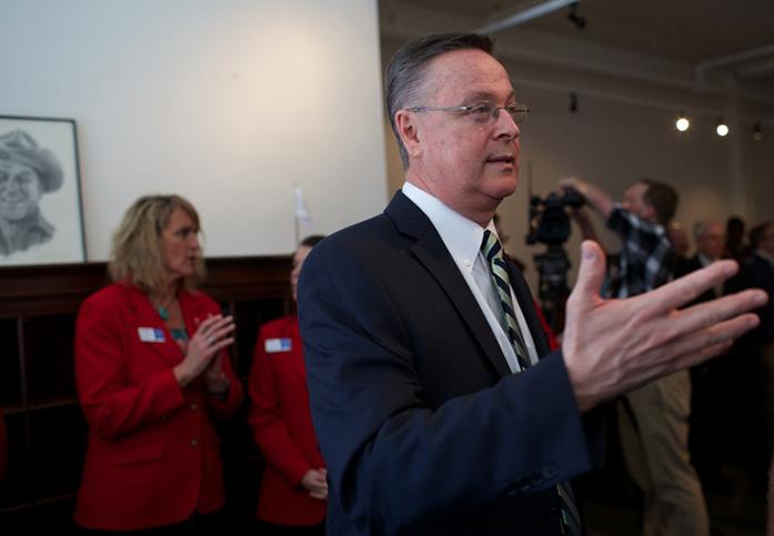 U.S. Rep. Rod Blum, R-Iowa, talks to guests at his ribbon cutting ceremony for his new office in Cedar Rapid on Tuesday, March 31, 2015. Blum has offices in Cedar Falls, Dubuque, and now Cedar Falls. (The Daily Iowan/Margaret Kispert)