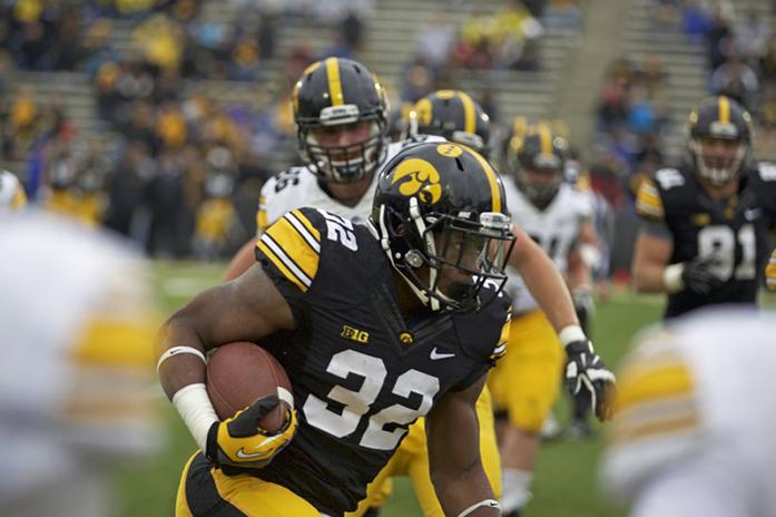Running back Derrick Mitchell, Jr. runs with the ball during the spring game on Saturday, April 25th, 2015. The Iowa offense and defense competed against each other in front of fans in Kinnick Stadium. The offense outscored the defense, 29-28. (The Daily Iowan/Rachael Westergard)