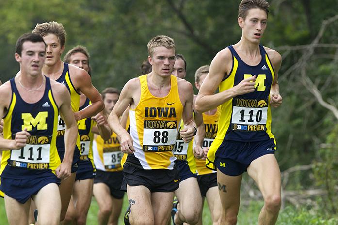 Iowa runner Kevin Lewis runs in the middle of the pack during the Big Ten Preview Mens 8k Race at Ashton Cross Country Course on Saturday, Sept. 20, 2014. Lewis finished third overall and had a time of 24:44.72 on the race. Iowa Men finished second and the Women finished fifth overall. (The Daily Iowan/Alyssa Hitchcock)