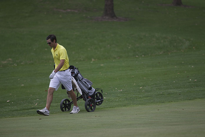 Iowa golfer Brian Bullington walks down the fairway during the Hawkeye-Great River Entertainment Invitational on Saturday, April 28, 2015. Iowa State won the meet, and Iowa came in second. 