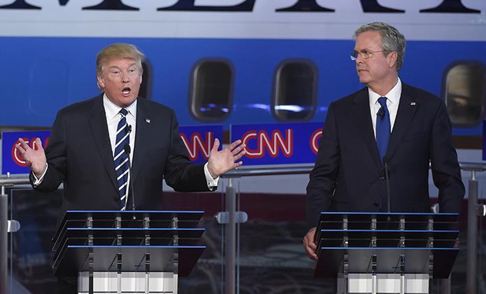 Republican presidential candidate, businessman Donald Trump, left, speaks as Jeb Bush looks on during the CNN Republican presidential debate at the Ronald Reagan Presidential Library and Museum on Wednesday, Sept. 16, 2015, in Simi Valley, Calif. (AP Photo/Mark J. Terrill)