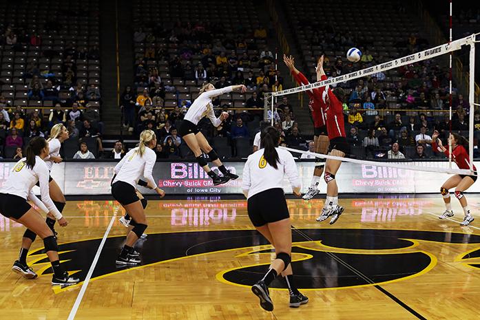 Iowa outside hitter Lauren Brobst attacks the ball during the Iowa-Maryland match in Carver-Hawkeye Arena on Wednesday, Nov. 26, 2014. The Hawkeyes defeated the Scarlet Knight, 3-2. (The Daily Iowan/Peter Kim)