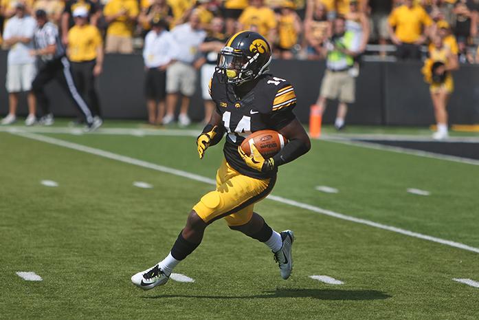 Iowa defensive back Desmond King runs with the ball in Kinnick Stadium on Saturday, Sept. 5, 2015. The Hawkeyes defeated the Redbirds, 31-14.