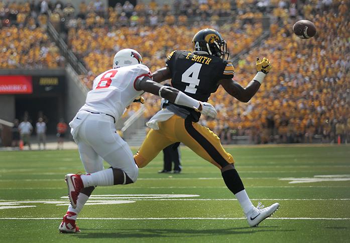 Iowa+wide+receiver+Tevaun+Smith+attempts+to+catch+the+football+with+Illinois+State+LaDarius+Newbold+close+behind+during+the+Iowa-Illinois+State+game+in+Kinnick+on+Saturday%2C+Sept.+5%2C+2015.+The+Hawkeyes+defeated+the+Redbirds%2C+31-14.+%28The+Daily+Iowan%2FMargaret+Kispert%29