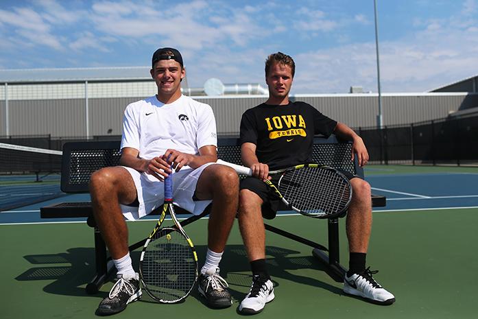 Iowa tennis players Nils Hallestrand and Robin Haden sit on the outside Hawkeye Tennis and Recreation courts on Wednesday, Sept. 2, 2015. Hallestrand and Haden were childhood friends from Danderyd, Sweden. (The Daily Iowan/Margaret Kispert)