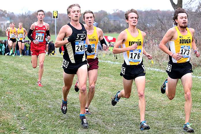 Purdue+runner+Caleb+Kerr+and+Iowa+runners+Nate+Ferree+and+Ben+Anderson+compete+against+each+other+at+the+Big+10+conference+cross+country+meet+on+Sunday%2C+Nov.+2%2C+2014.+Michigan+State+won+the+womens++title%2C+and+Wisconsin+claimed+the+mens+title.+For+individual+titles%2C+Michigan+State+runner+Leah+OConner+won+the+womens+race%2C+and+Wisconsin+runner+Malachy+Schrobilgen+won+the+mens+race.+%28The+Daily+Iowan%2FJohn+Theulen%29