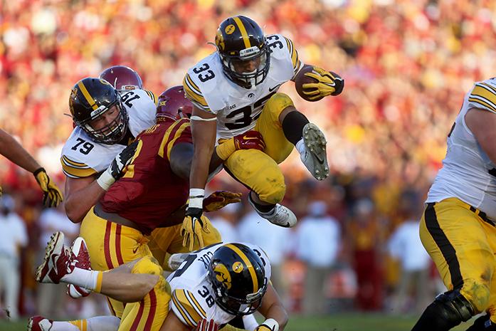 Iowa+runing+back+Jordan+Canzeri+jumps+over+Iowa+full+back+Adam+Cox+during+the+Cy-Hawk+Series+game+against+Iowa+State+in+Jack+Trice+Stadium+in+Ames%2C+Iowa+on+Sept.+12%2C+2015.+The+Hawkeyes+defeated+the+Cyclones%2C+31-17.+%28The+Daily+Iowan%2F+Alyssa+Hitchcock%29