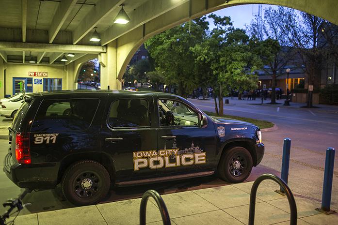 A police car sits inside the a parking garage on May 4, 2015.  (The Daily Iowan/Sergio Flores)