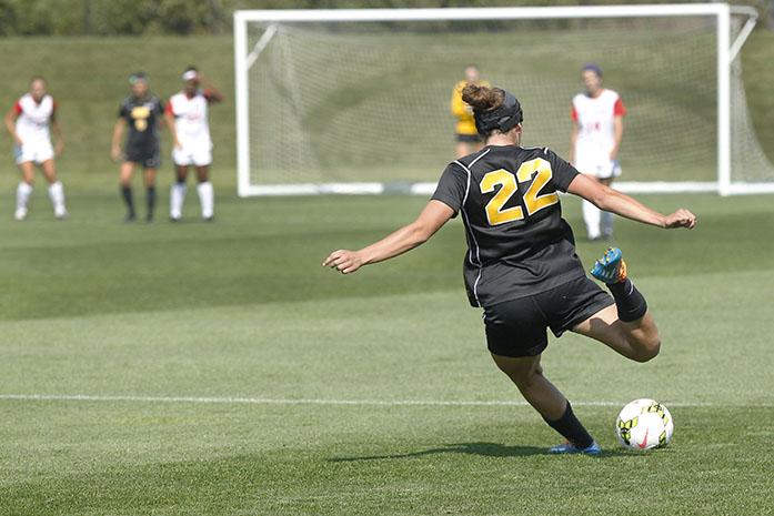 Iowa defender Melanie Pickert kicks the ball against Rutgers at the Iowa Soccer Complex on Sunday, Sept. 29, 2014. The Hawkeyes lost to the Scarlet Nights, 1-0. (The Daily Iowan/Margaret Kispert)