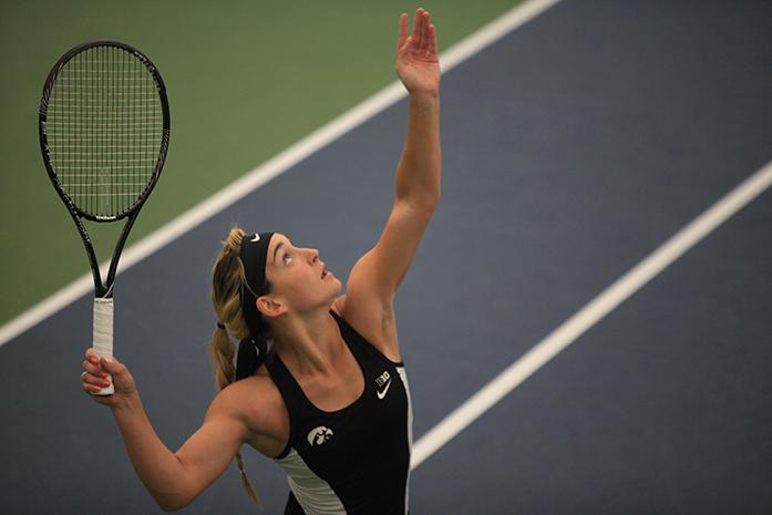 Iowas Annette Dohanics serves during a doubles match at Carver-Hawkeye Arena on Friday, April 10, 2015. Dohanics and McCulloch defeated Blik and Kisialeva, 8-3. Ohio State defeated Iowa, 5-2. (The Daily Iowan/Rachael Westergard)