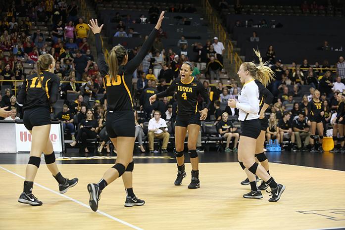 The Iowa team celebrates a point during the Cy-Hawk Series in Carver-Hawkeye Arena on Friday, Sept. 11, 2015. The Hawkeyes defeated the Cyclones for the first time in 18 years, 3-1. (The Daily Iowan/Margaret Kispert)