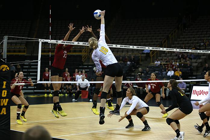 Iowa outside hitter Lauren Brobst spikes the ball in Carver-Hawkeye Arena on Wednesday, Nov. 5, 2014.  The Hawkeyes beat the Hoosiers 3-2. (The Daily Iowan/John Theulen)