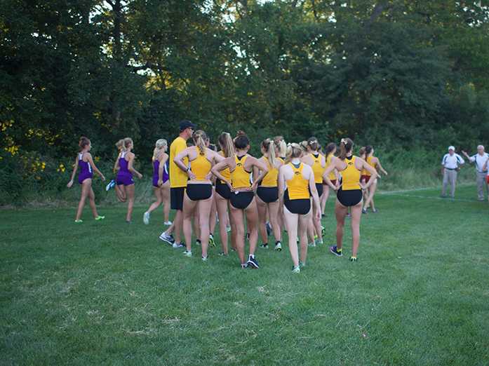 The Iowa Womens Cross Country team walk to the starting line of their 3k race on Friday, Sep. 4, 2015, at the Ashton Cross Country Course in Iowa City, Iowa.