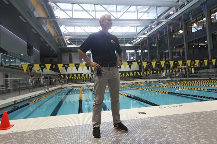 Iowa head coach Marc Long talks to the reporters during media day at the CRWC on Wednesday, Oct. 1, 2014. The swimming team opens there season at home this Friday hosting Michigan and Nebraska.