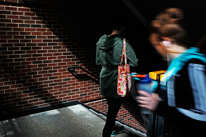 Students leave classes in the Adler Building on Thursday. Adler has been the home of the School of Journalism and Mass Communication  and the Cinematic Arts Department since 2005. (The Daily Iowan/Jordan Gale)