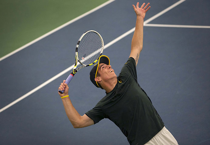 Iowa’s Dom Patrick serves during the Iowa-Chicago State match at the Hawkeye Tennis & Recreation Complex on April 19. The Hawkeyes defeated the Cougars, 6-0. (The Daily Iowan/Margaret Kispert)