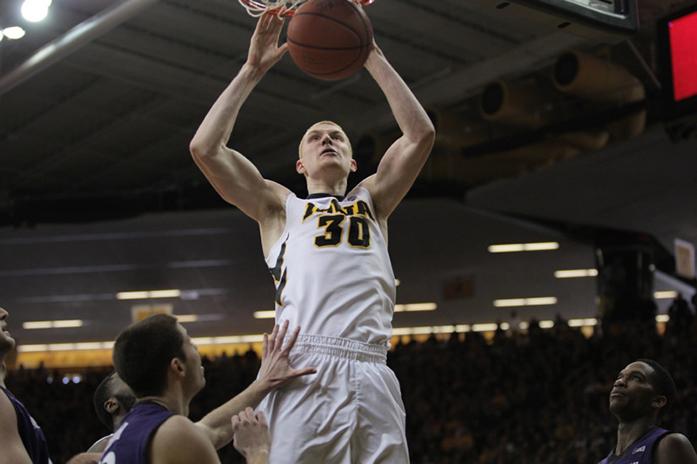 Iowa forward Aaron White dunks against Northwestern at Carver-Hawkeye Arena on Saturday, Mar. 7, 2015 in Iowa City, Iowa. White finished the game with 25 points, 8 rebounds, and 1 block. The Hawkeyes defeated the Wildcats, 69-52. (The Daily Iowan/Joshua Housing)