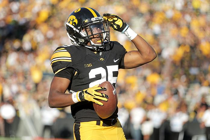 FILE - Iowa running back Akrum Wadley celebrates after his touchdown during the Iowa-North Texas game in Kinnick Stadium on Saturday, Sept. 26, 2015. The Hawkeyes defeated the Mean Green, 62-16. (The Daily Iowan/Valerie Burke, file)