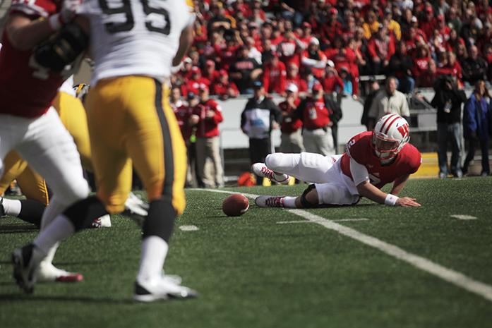 Wisconsin quarterback Joel Stave fumbles the ball during the Iowa-Wisconsin game in Camp Randal Stadium on Saturday, Oct. 3, 2014. The Hawkeyes defeated the Badgers, 10-6. (The Daily Iowan/Margaret Kispert)