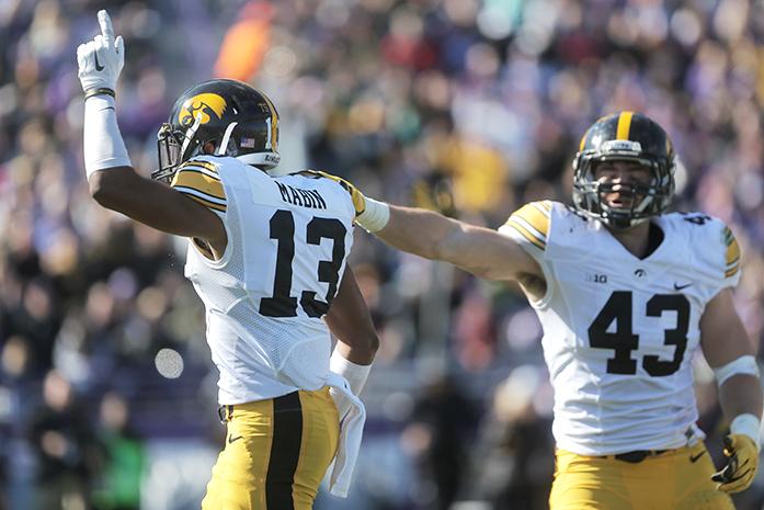 Iowa defensive back Greg Mabin celebrates after receiving possession of a fumbled ball during the Iowa-Northwestern game on Saturday, Oct. 17, 2015. Northwesterns offense had two fumbles and one interception throughout the game. The Hawkeyes beat the Wildcats, 40-10. (The Daily Iowan/Valerie Burke)