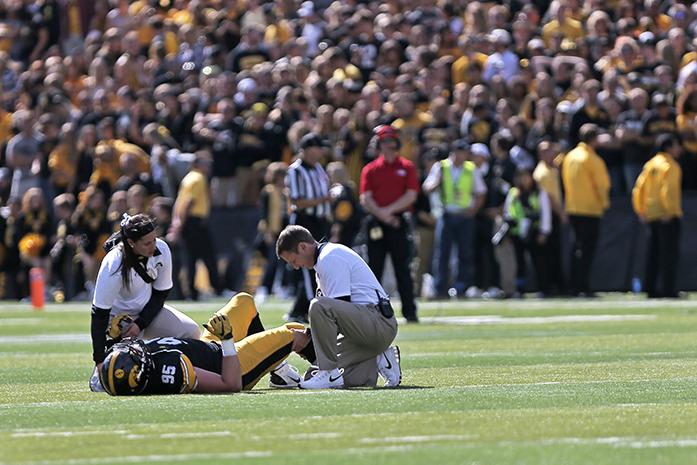 Iowa defensive lineman Drew Ott gets looked at after an injury during the Homecoming game against Illinois in Kinnick Stadium on Saturday, Oct. 10, 2015. The Hawkeyes defeated the Illini 29-20. (The Daily Iowan/Valerie Burke)