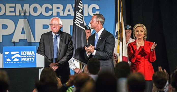 (from left) Vermont senator Bernie Sanders, former Maryland governor Martin OMalley and former Secretary of State Hillary Clinton stand on stage of the Iowa Democratic Hall of Fame ceremony on Friday, July 17, 2015. Five democratic presidential candidates gave speeches during the event. (The Daily Iowan/Sergio Flores)