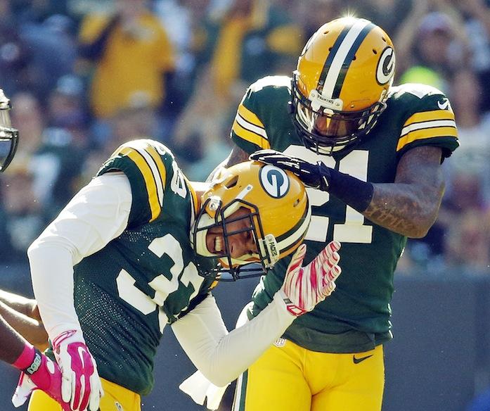 Green Bay Packers Micah Hyde (33) is congratulated by Ha Ha Clinton-Dix (21) after intercepting a pass during the first half an NFL football game against the St. Louis Rams Sunday, Oct. 11, 2015, in Green Bay, Wis. (AP Photo/Mike Roemer)