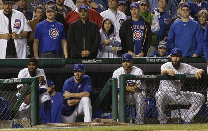 The Chicago Cubs bench watches during the ninth inning of Game 3 of the National League baseball championship series against the New York Mets Tuesday, Oct. 20, 2015, in Chicago. (AP Photo/David J. Phillip)