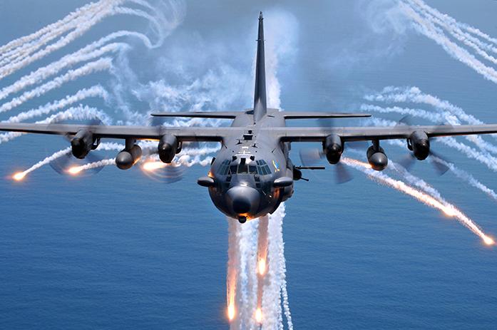 An AC-130H gunship from the 16th Special Operations Squadron, Hurlburt Field, Fla., jettisons flares as an infrared countermeasure during multi-gunship formation egress training on Aug. 24, 2007. (U.S. Air Force photo by Senior Airman Julianne Showalter) (RELEASED)