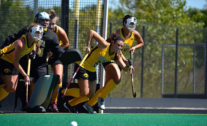 The Iowa team runs out of the goal for a penalty corner at Grant Field on Saturday, Sept. 12, 2015. The Hawkeyes defeated the Golden Flashes 7-1. (The Daily Iowan/Valerie Burke)