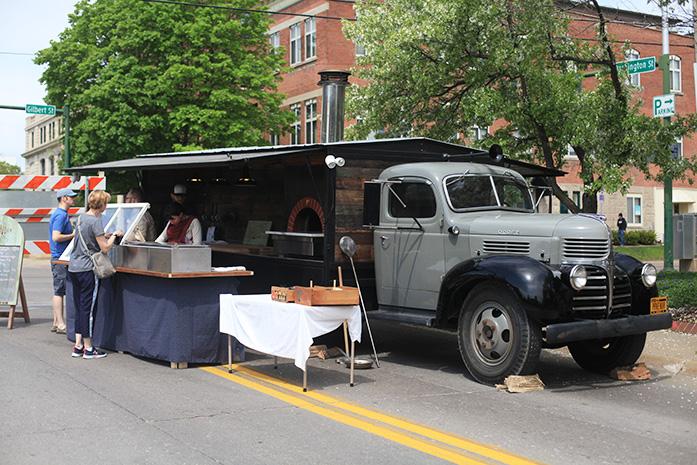 The Provender, a new food truck, parks at the Iowa City Farmers Market on Saturday, May 2nd. The Provender specializes in wood-fired pizza and offers beer, root beer, and an assortment of wines. (The Daily Iowan;Rachael Westergard)
