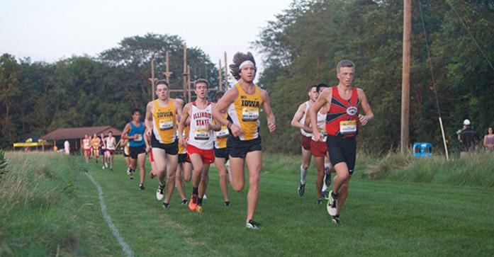 Junior Kevin Docherty keeps his place in the front of the pack next to unattached Freshman Bailey Hesse-Withbroe during the mens 6k race on Friday, Sep. 4, 2015 at the Ashton Cross Country Course in Iowa City, Iowa. (The Daily Iowan/Brooklynn Kascel)