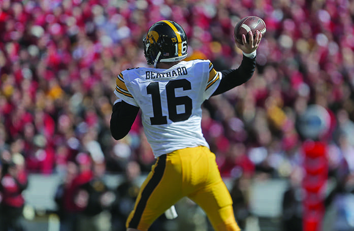 Iowa quarterback C.J. Beathrad attempts to throw the ball during the Iowa-Wisconsin game in Camp Randal Stadium on Saturday, Oct. 3, 2014. The Hawkeyes defeated the Badgers, 10-6. (The Daily Iowan/Margaret Kispert)