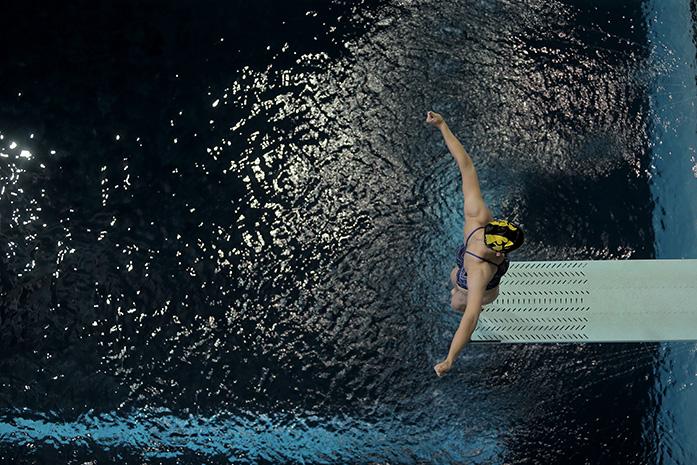 A female diver prepares to jump at the CRWC at the University of Iowa on October 20, 2015. (Daily Iowan/Karley Finkel)