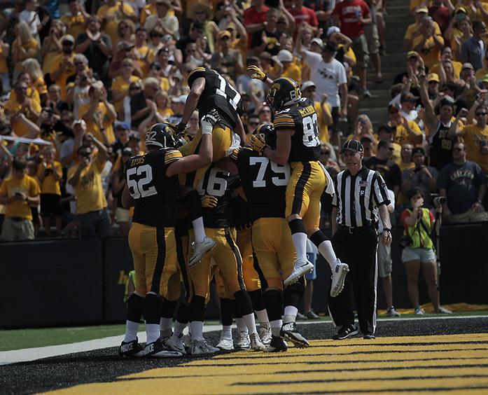 The Iowa team celebrates Jordan Canzeris touchdown during the Iowa-Illinois State game in Kinnick on Saturday, Sept. 5, 2015. The Hawkeyes defeated the Redbirds, 31-14. (The Daily Iowan/Margaret Kispert)