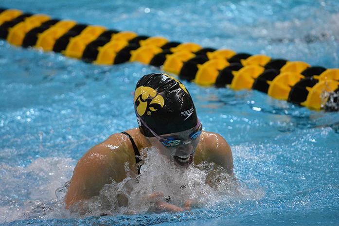Iowa swimmer Olivia Kabacinski comes out of the water during the womens 100 breaststroke at the CWRC during the Hawkeye Invitational on Saturday, Dec. 6, 2014. The womens team defeated all the teams with a score of 1,015.5. (The Daily Iowan/Margaret Kispert)