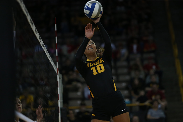 Iowa setter Loxley Keala dips the ball over the net during the Cy-Hawk Series in Carver-Hawkeye Arena on Friday, Sept. 11, 2015. The Hawkeyes defeated the Cyclones for the first time in 18 years, 3-1. (The Daily Iowan/Margaret Kispert)