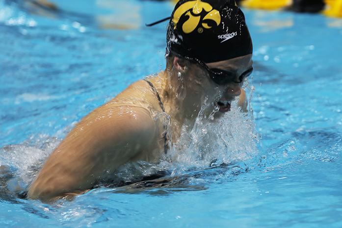 Izzie Bindseil comes up for a breath as she competes against Michigan State Thursday night October 15th at the CRWC in Iowa City. The Iowa women won the meet tonight against Michigan State, 44-9. (The Daily Iowan/Kyle Close)