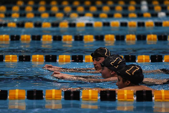 A group of Iowa swimmers cool down after doing laps after media day at the CRWC on Wednesday, Oct. 1, 2014. The swimming team opens there season at home this Friday hosting Michigan and Nebraska. (The Daily Iowan/Margaret Kispert)